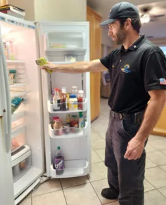 Jason checking refrigerator temperature